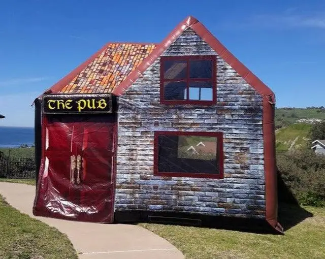 An inflatable pub of the same type pitched on a bright day by the coast